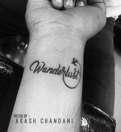 Wanderlust ! Tattoo Designed by @the_inkmann | Tattoos | Ecriture tatouage, Tatouage femme, Tatouage