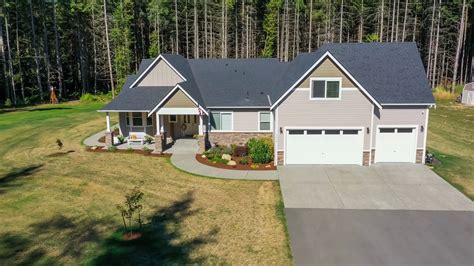 Aerial view of an American suburban home, rising up from ground level to birds eye view of roof ...