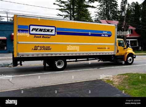 A Penske Truck Rental cargo van driving through Speculator, NY Stock Photo - Alamy