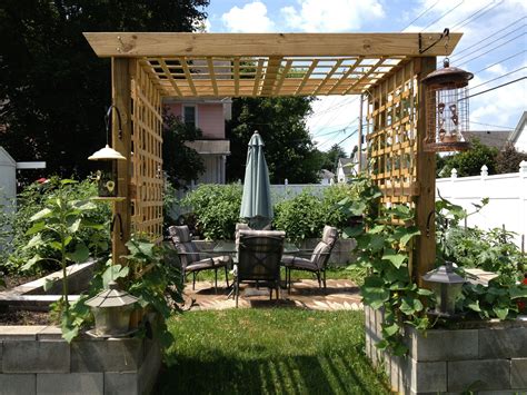 2013 Layout. Seating area in middle, trellis entry. | Cinder block garden, Small backyard ...