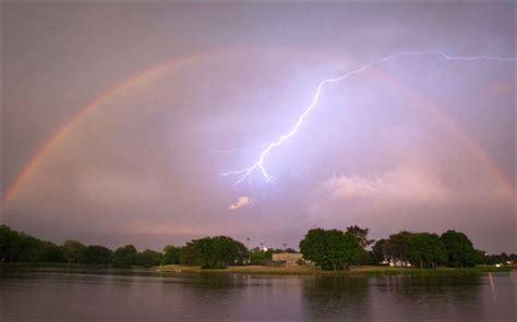 Suburban spaceman: Lightning bolt striking through a Rainbow