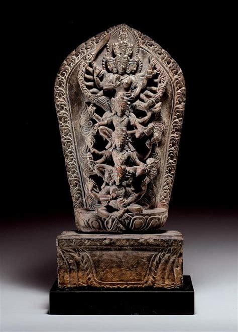 Brahma, Vishnu, Shiva and Mahadevi Gray Stone Nepal The finely carved, arched stele supported on ...