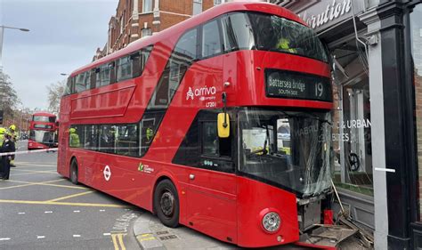 Double-decker crash sees London bus smash into shop as passenger ...