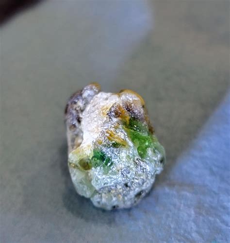 What is this small rock with green crystals found on a beach in MA? : r/whatsthisrock