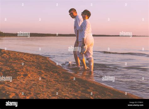 Happy senior couple on the beach Stock Photo - Alamy