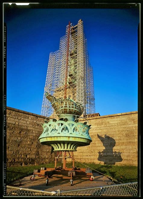 VIEW OF FLAME AND TORCH PLATFORM SITTING AT THE BASE OF FORT WOOD AFTER REMOVAL ON JULY 4, 1984 ...