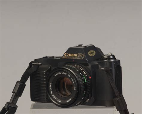 Canon T50 35mm film SLR camera w/50mm f1.8 lens + Speedlite flash (ser ...