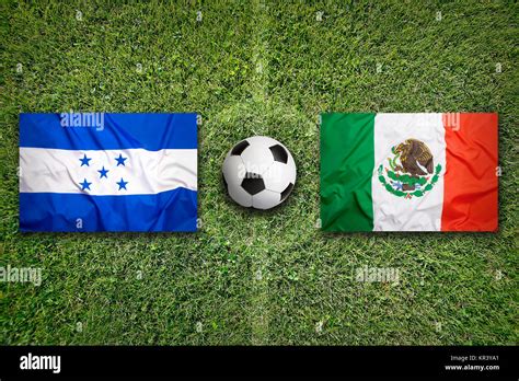 Honduras vs. Mexico flags on green soccer field Stock Photo - Alamy