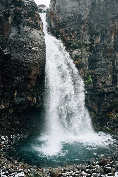 "Snowy Waterfall" by Stocksy Contributor "Cameron Zegers" - Stocksy