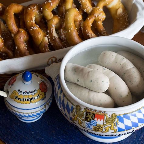 Traditional WEISSWURST (WHITE SAUSAGE) meal, served with sweet mustard and soft pretzels ...