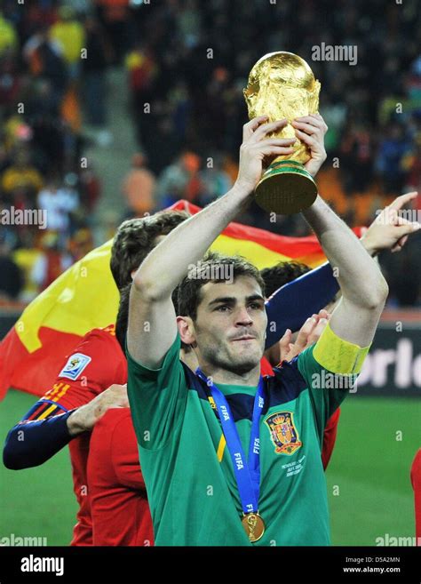 Goalkeeper Iker Casillas of Spain celebrates with the trophy after ...