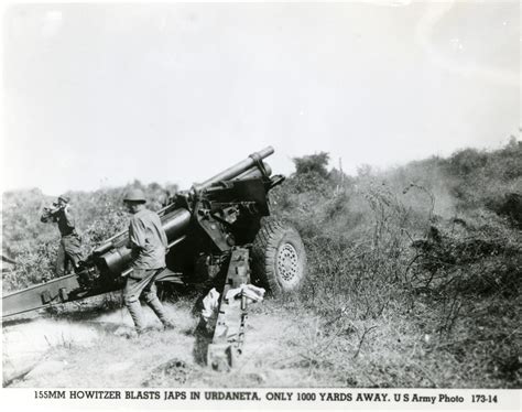 US soldiers firing a M114 155 mm howitzer at Japanese forces, Urdaneta ...