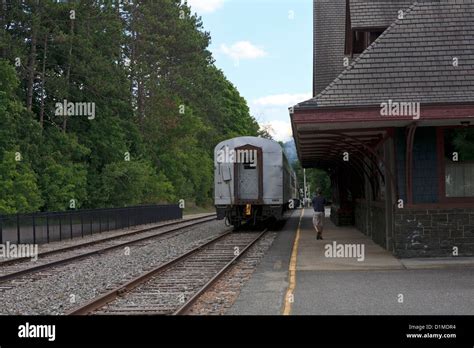 Passenger tourism chain leaving a train station Stock Photo - Alamy