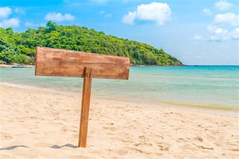 Free Photo | Wooden signboard on tropical beach