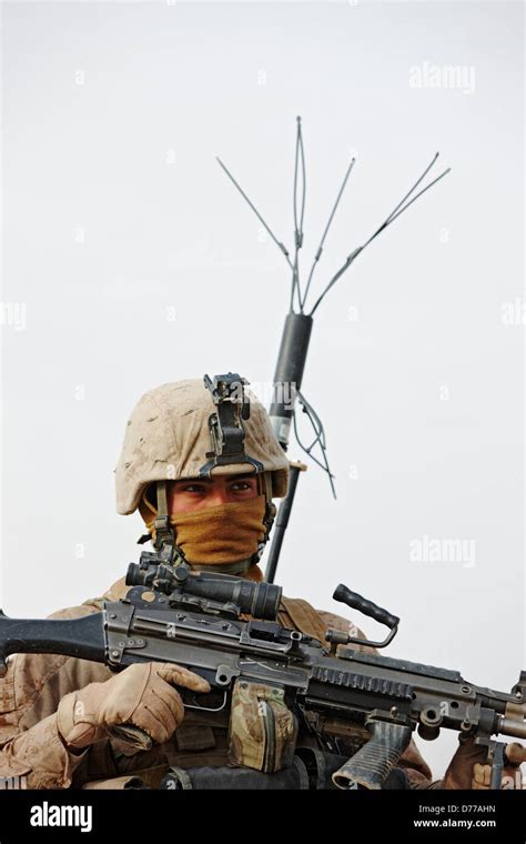 A U.S Marine Holds M249 Squad Automatic Weapon or SAW Wears Electronic ...