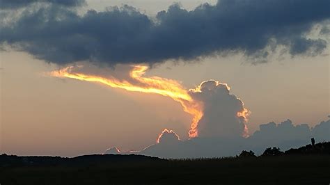 Unusual Cloud Looks Like a Huge ‘Dragon’ Breathing Fire Into the Sky