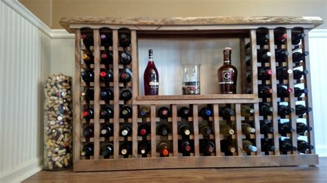 a wooden wine rack with bottles in it