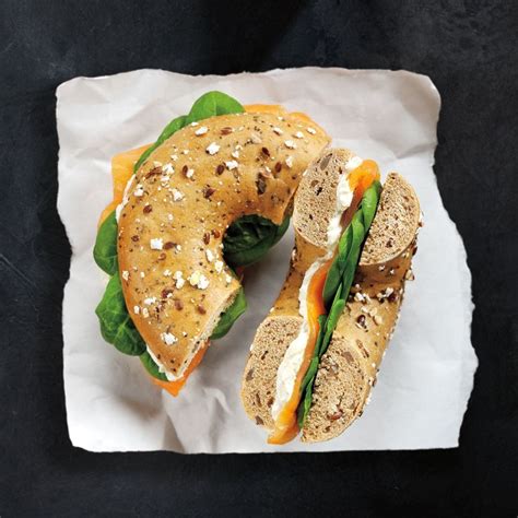 A delicious bagel filled with soft cream cheese and fresh dill topped ...