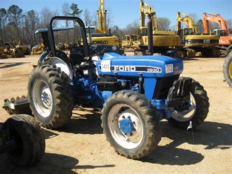 FORD 3930 4X4 FARM TRACTOR - J.M. Wood Auction Company, Inc.