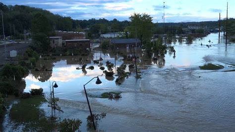 Flooding, damage, debris along French Broad River in Asheville, NC