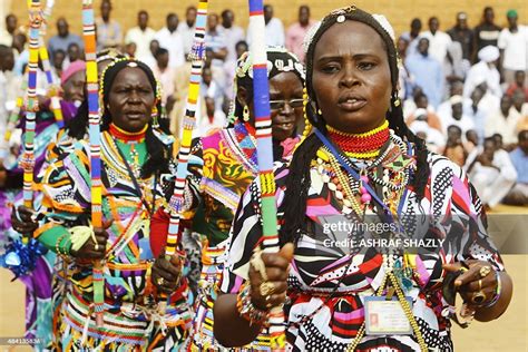 Members of Sudan's Nuba community perform a traditional dance during ...