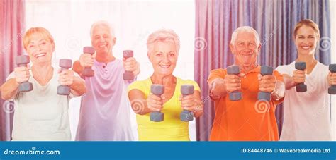 Portrait of Seniors Exercising with Weights Stock Photo - Image of head ...