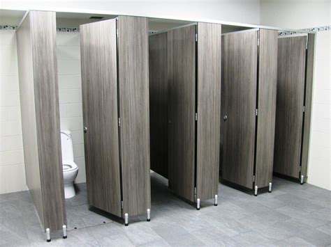 Male toilet partitions with special 100mm leg in a timber grain compact ...