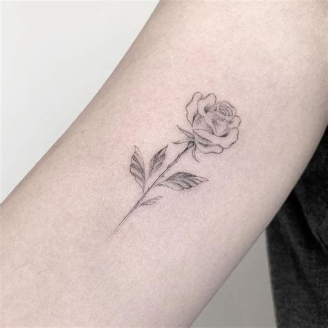 Fine line blackwork rose tattoo | Realistic rose tattoo, Small rose tattoo, Rose tattoos