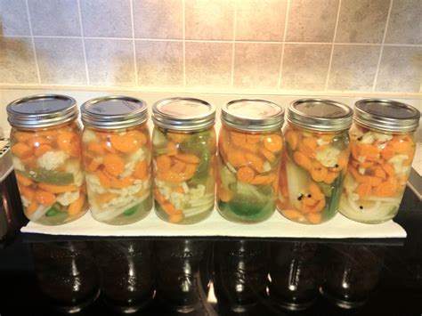 My first attempt at pickled carrots, jalapenos, cauliflower & onions ...