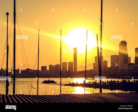 View of Benidorm skyline at sunset through yacht masts Stock Photo - Alamy