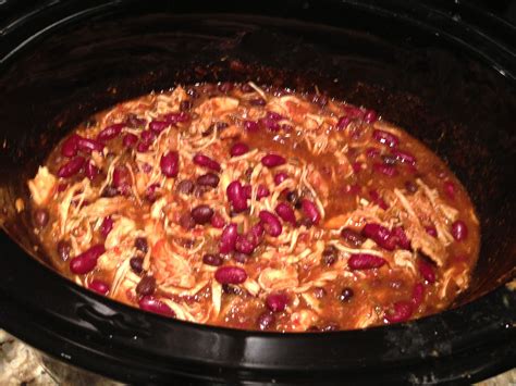 Crock pot chicken tacos. 2.5 lbs chicken, 1 large jar of costco organic salsa, packet of taco ...