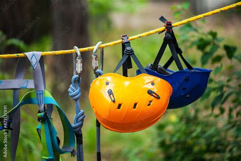 Safety helmets in adventure park. Tourist summer time adventure park family and company team ...