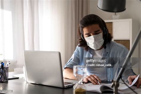 Young Man Studying And Working On Laptop At Home High-Res Stock Photo - Getty Images