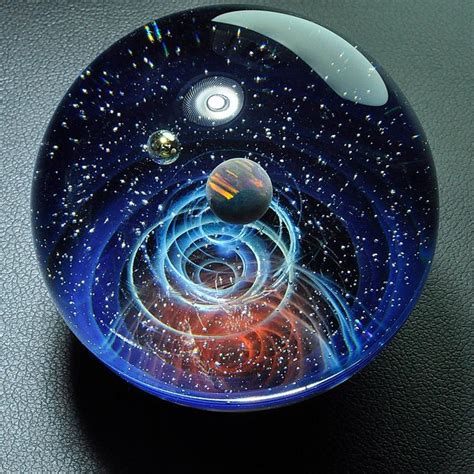 a glass bowl with an image of the planets in it