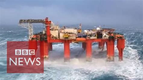 Huge waves crash against swaying North Sea oil rig - YouTube