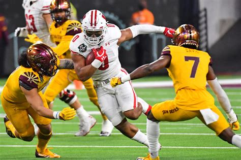 Fan Fight Breaks Out During Arizona State-Wisconsin Bowl Game In Vegas ...