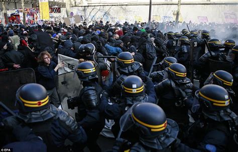 Protesters in Paris hurl bricks and paint bombs to protest new ...