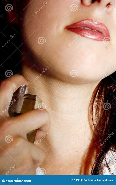 Spraying perfume on neck stock photo. Image of applying - 11980924