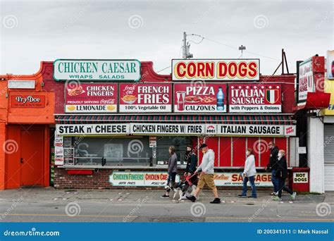 Tourists Walk Past Closed Colorful Restaurant on the Hampton Beach Boardwalk Editorial Photo ...