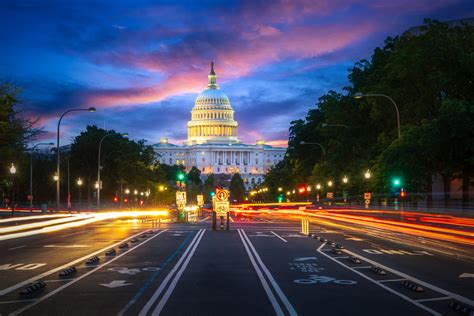 Capital building in Washington DC city at night wiht street and ...