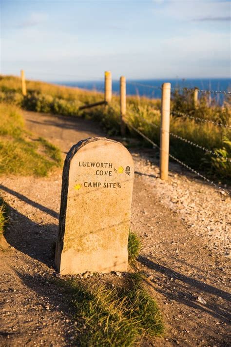 Lulworth Cove Campsite Mile Stone and Coast Path at Sunset Stock Photo - Image of background ...