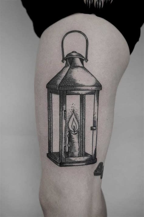 Woodcut style black lantern tattoo by Sva inked on the left thigh | Lantern tattoo, Leg tattoos ...