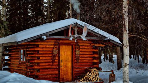 Winter log cabin in Alaska - backiee