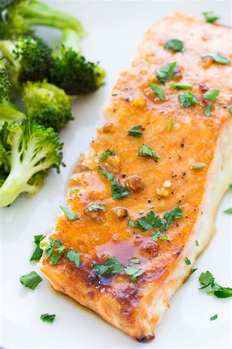 This easy oven baked salmon recipe is our favorite! With a honey, Dijon and garlic sauce and ...