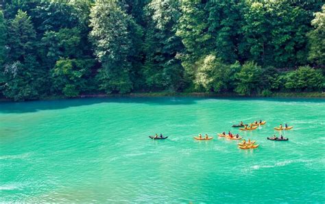 Premium Photo | Kayaks on the river aare. rafting on the river aare ...