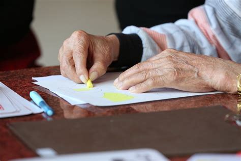 Elderly person during drawing therapy · Free Stock Photo