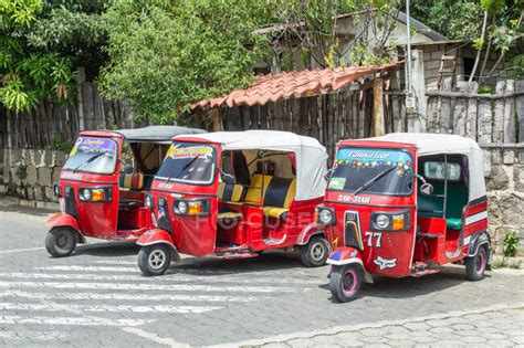 Guatemala, Solola, San Pedro La Laguna, tuk tuk vehicles on city street ...