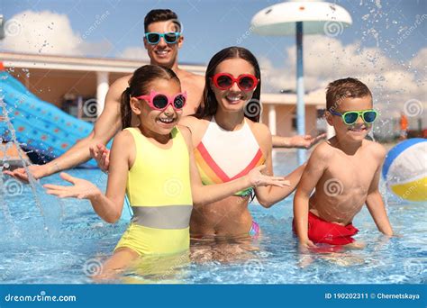 Family Having Fun at Water Park. Summer Vacation Stock Image - Image of portrait, resort: 190202311