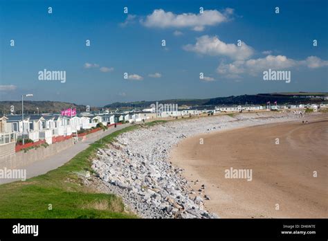 Trecco Bay beach and holiday park mobile homes and caravans along shore Porthcawl Bridgend ...