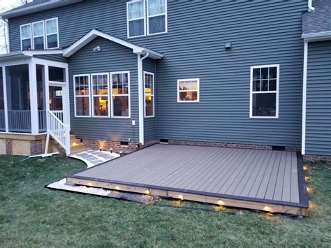 Diy ground level composite deck. Led lighting. Stone border Ground Level Deck, How To Level ...